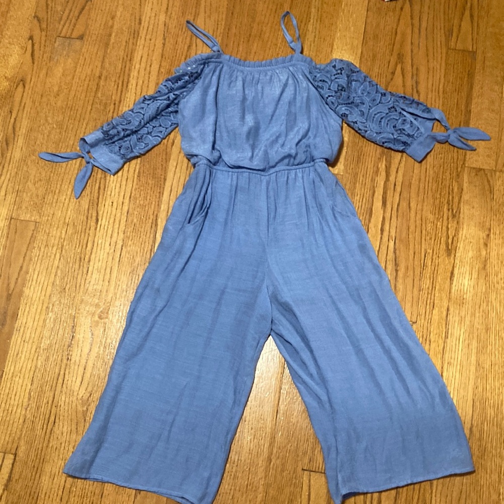 Light Blue girls 7/8 long sleeved jump suit, pockets and detailed sleeves.
